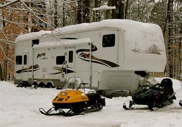 Travel trailer and snowmobiles